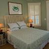 "Crab" Bedroom: Headboard of pickled cypress with slatted design to relate to pair of cypress "crab pot" nightstands.

