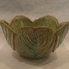 Stoneware bowl with four carved Hosta leaves.