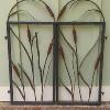 Pair of hand wrought cattail gates (each 20" wide, 40" tall).  