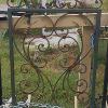 Single wrought iron gate, painted and distressed.