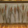 Here in the low country of South Carolina, we have a lot of cattails and I thought making/distressing them would be an interesting and very local kind of thing.  I buy the ready made cattail stems from King Architectural Metals and buy their acanthus leaves and beat out curves until they are flat.