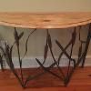 Demilune Wrought Iron Cattail Table (48" wide, 18" deep, 32" tall).  Hand wrought cattails and cattail leaves, worm-eaten pine top, 